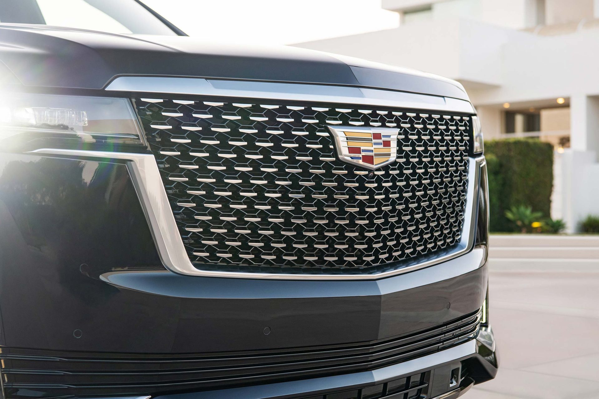 MK Luxury Limo black luxury SUV on a scenic road